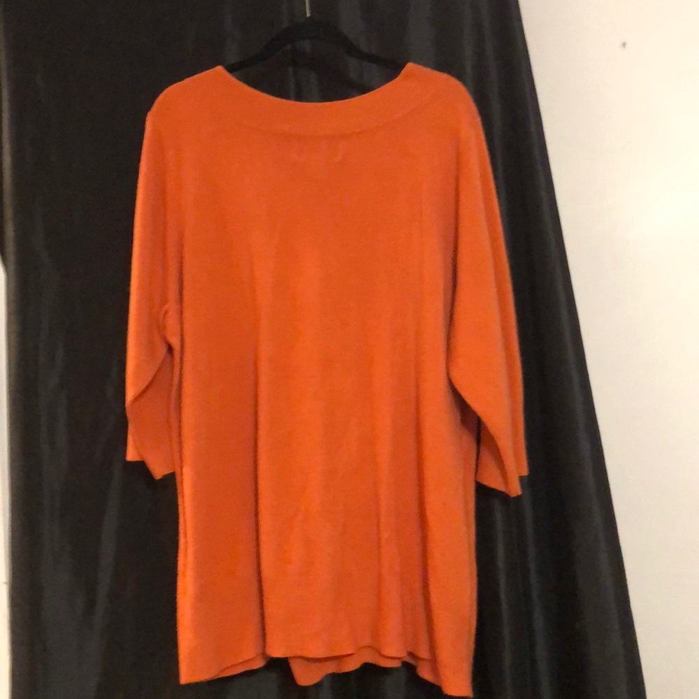 Orange v-back sweater from avenue design.
